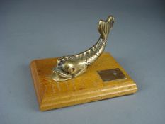 HMS Hood - a brass dolphin door fitting on oak plinth, mounted together with a brass plaque