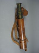 A leather cased four draw telescope unsigned, the leather case with address for R J Wollen, St Anns,