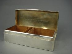 HMS Cyclops- a silver presentation cigarette box by Goldsmith & Silversmith Co, the engine turned