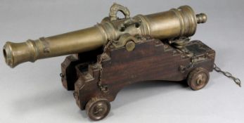 A 19th Century bronze model of a cannon, the 14 inch three stage barrel with dolphin chased