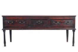 An 18th Century oak rectangular dresser base, with a moulded edge, fitted with three short drawers