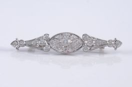 A diamond mounted bar brooch with central navette-shaped cluster, the diamonds estimated to weigh