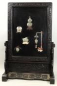 A Chinese hardstone-inlaid lacquer and hardwood screen and stand the black lacquer rectangular panel