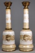 A pair of 19th century opaque glass oil lamp bases, with acanthus scroll bands and gilt brass