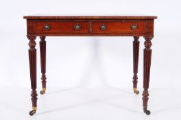A George IV mahogany rectangular writing table, the top inset with a panel of tooled leather,