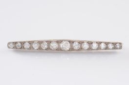 A diamond mounted line bar brooch, millegrain-set with graduated old-brilliant cut diamonds
