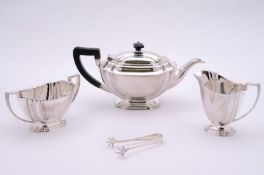 A George VI silver three piece tea set, maker HA, Sheffield, 1940, of rectangular form with recessed