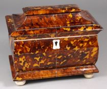 A 19th century blonde tortoiseshell bombe tea caddy, with cushion and domed hinged lid enclosing two