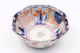 A Japanese Fukugawa porcelain bowl of octagonal form the interior decorated with panels of iris