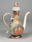 A Japanese porcelain ewer of flattened pear shaped form enamelled with a pair of opposing phoenix on