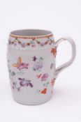 A Chinese porcelain tankard of swelling cylindrical form, the grooved and plaited strap handle