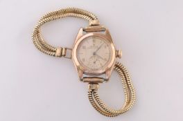 A lady’s gold ‘Rolex Oyster perpetual’ wristwatch, the circular dial with Arabic numerals and