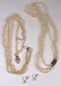 A cultured pearl three string necklace with diamond clasp, a simulated pearl necklace and a pair