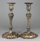A pair of Hunt and Roskell silver plated candlesticks in the French taste, the nozzles with