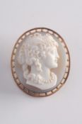 An oval layered agate cameo portrait brooch carved depicting a young woman wearing a pearl necklace,