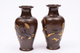 A pair of Japanese bronze vases, Meiji period, of baluster form with inlaid silver and gold