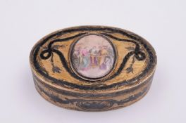 An Imperial Russian silver-gilt oval box, maker A.K, Moscow, the hinged lid with niello inlay and