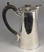 A George VI silver hot water jug, maker HW, Sheffield, 1943, of tapering cylindrical form, 15.92ozs.