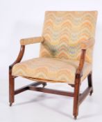 An 18th Century mahogany, oak and elm library armchair of Gainsborough type, with a rectangular