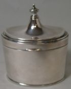 A small silver tea caddy, of oval form, with hinged lid, Birmingham 1929, 3.84oz.