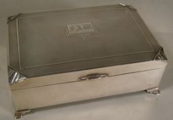 A George V silver cigarette box, makers mark worn, Birmingham, 1933  of rectangular outline,