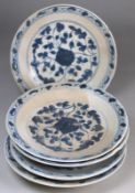 Tek Sing Cargo - five Chinese porcelain saucers of circular form painted in blue with peony scroll