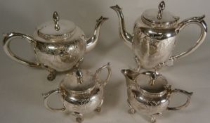 A plated four piece tea and coffee service of globular form, with engraved foliate decoration, on