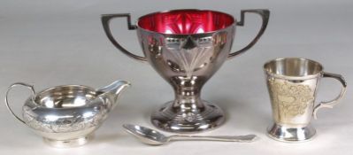 A George V silver cream jug, maker CSC&Co, Birmingham 1911 of a compressed circular form,