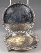 A Portuguese circular silver card tray, also one other of similar design, raised on leaf shaped