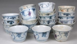 Tek Sing Cargo - twenty Chinese porcelain tea bowls of circular form painted in blue with four