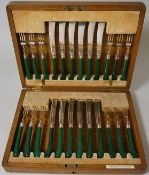 Waring & Gillow,  a set of twelve plated fruit knives and forks with faux malachite pistol grip
