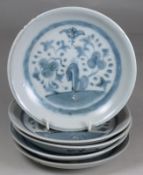 Tek Sing Cargo - five Chinese porcelain dishes of circular form painted in blue with peony like