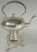 A Victorian plated tea kettle on stand of squat globular outline, having scroll and banded