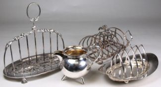 An unusual plated seven bar toast rack, of a single floral capped bar support on an oval pierced