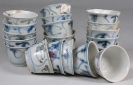 Tek Sing Cargo - twenty small Chinese porcelain tea bowls of circular form painted in blue with four