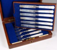 A set of six mother of pearl and silver fruit knives and six matching forks, maker Goldsmiths and