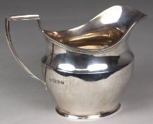 A George V silver cream jug, maker S. Blanckensee & Son Ltd, Chester, 1930 of barge shape outline