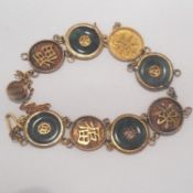 A jade mounted bracelet  comprising of circular, jade links and circular links with Chinese
