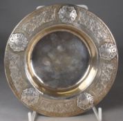 A George V silver circular dish, maker Liberty & Co, Birmingham, 1928 the rim decorated with