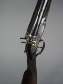 A 12 bore side by side hammer shotgun by William Powell & Son, Birmingham: the 28 inch barrels