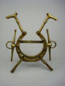 A Victorian brass equestrian photograph frame:, of a horseshoe over crossed riding crops with bit,