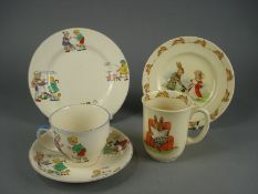 A Nursery ware trio decorated with nursery rhymes and a Royal Doulton Bunnykins plate and mug:.