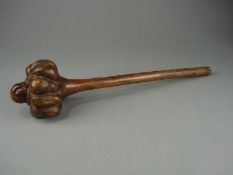 A 19th century Fijian Ula (throwing club):, the carved root lobed head on a shaft with geometric