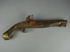 A 19th century flintlock pistol by Tower of London:, stirruped ramrod , side lock action with