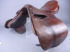 An early 20th Century brown leather saddle:.