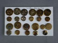 A collection of twenty-three various American fox hunt buttons:.