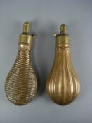 Two Victorian copper powder flasks with repousse decoration: (2)