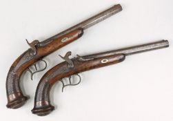A pair of 19th century French percussion cap pistols:, the 10 1/2 inch octagonal barrels gilt inlaid