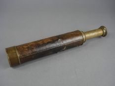 A brass four draw leather cased telescope by Woodruff of Margate:.