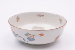 A Chantilly trembleuse toilet bowl painted in the Kakiemon palette with flowering branches and